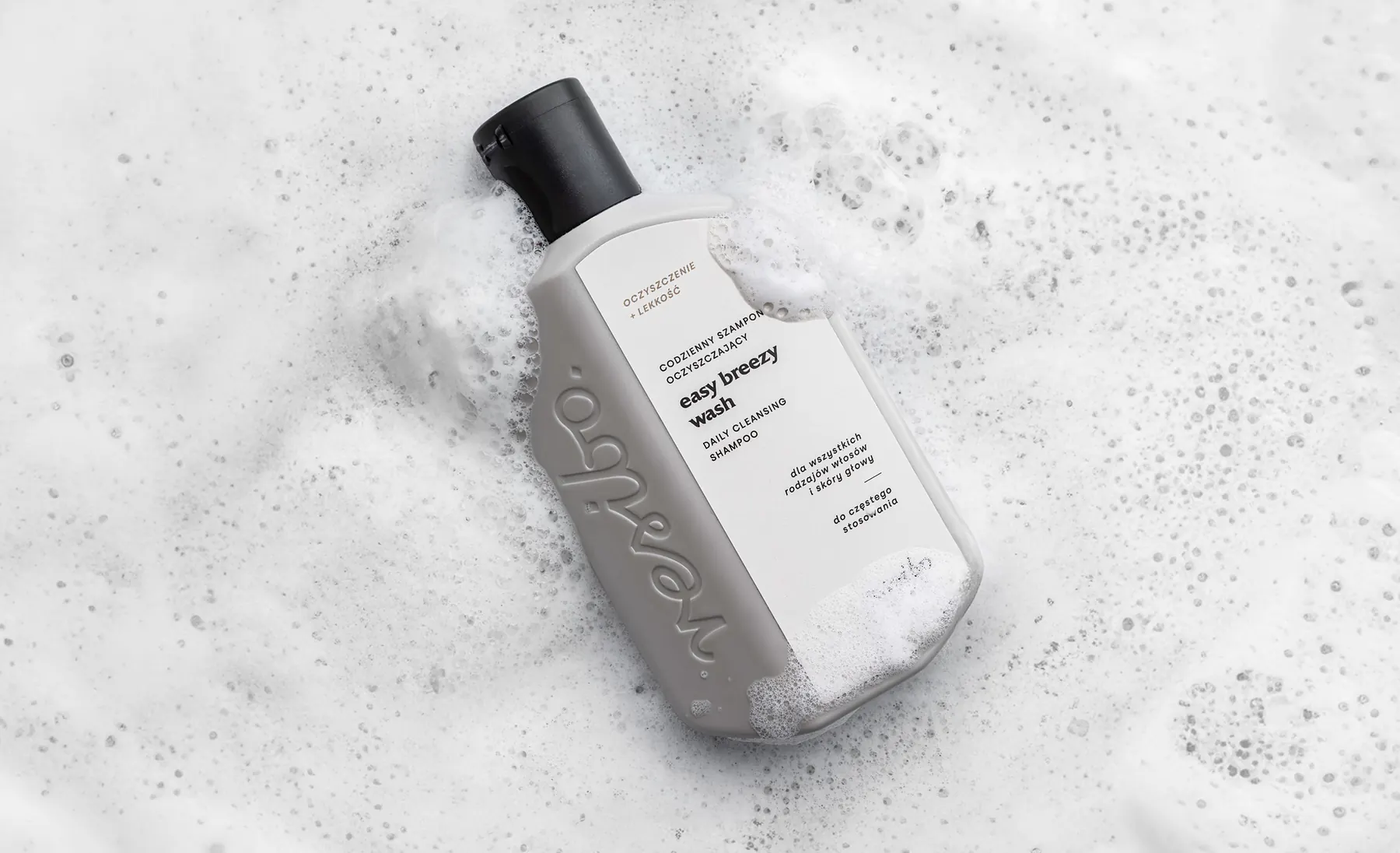 Resibo Hair Care bottle surrounded by foam