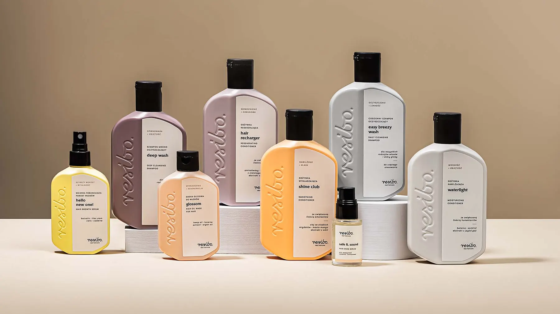 Resibo Hair Care bottles on a beige background